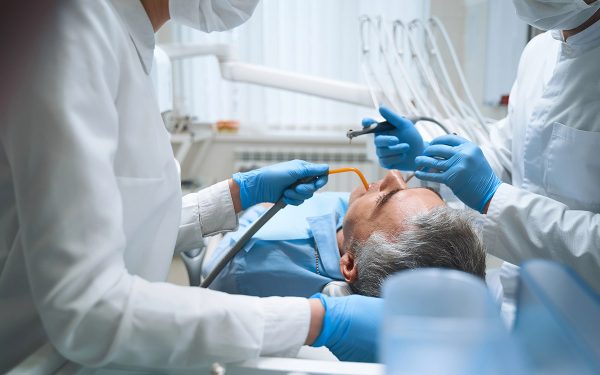man-with-cavities-at-the-dentist man with cavities at the dentist