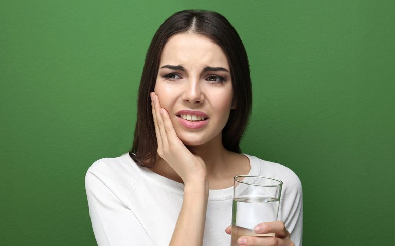 woman with tooth sensitivity