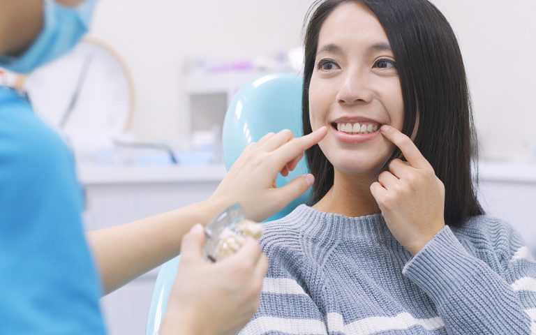woman at the dentist with Dental implants