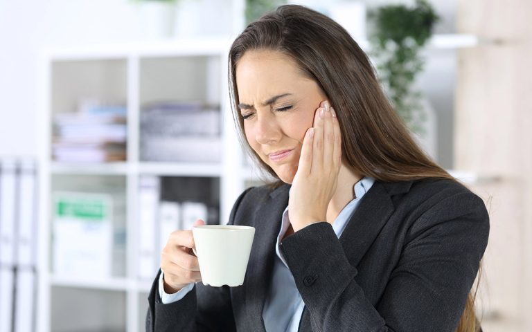 woman with tooth sensitivity