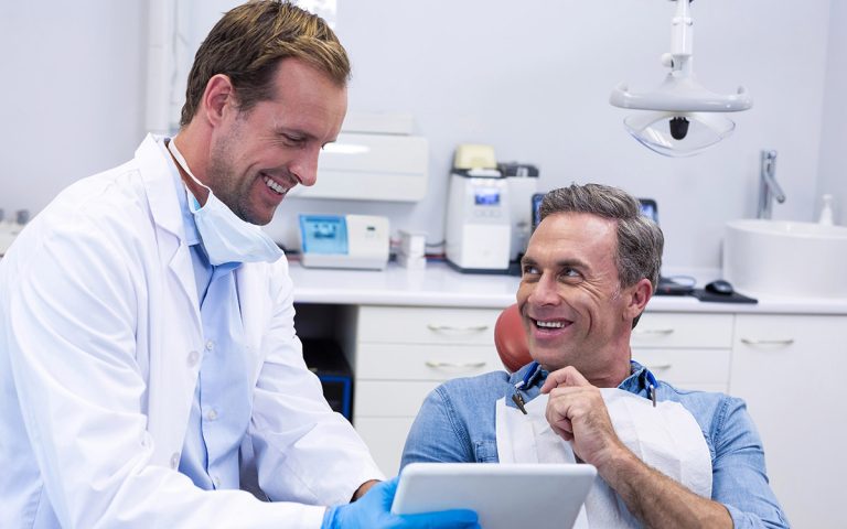 man smiling at his dental appointment