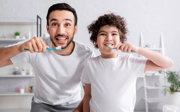 dad-and-son-brushing-their-teeth dad and son brushing their teeth