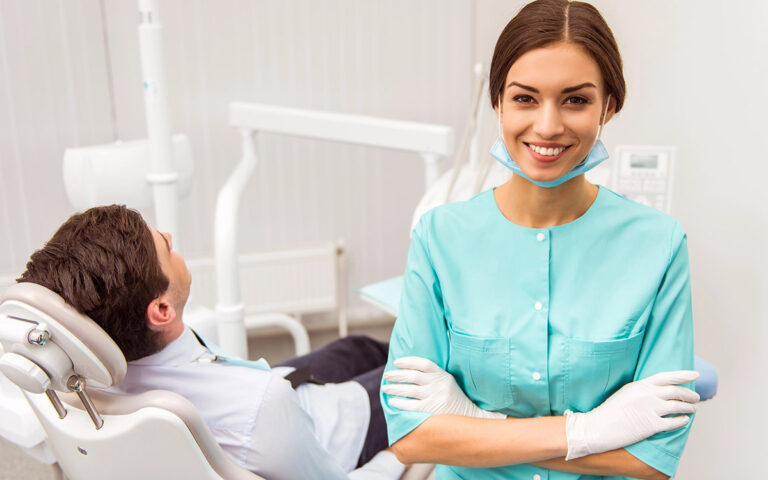 dentist with patient at her clinic