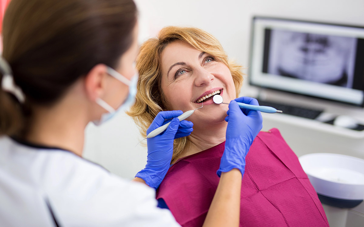 woman smiling at her dental appointment