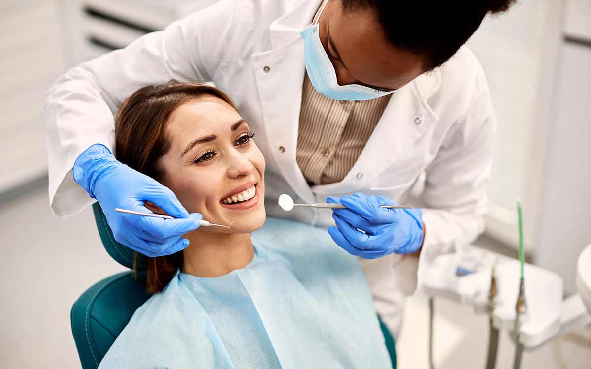 woman having her teeth checked during dental appointment