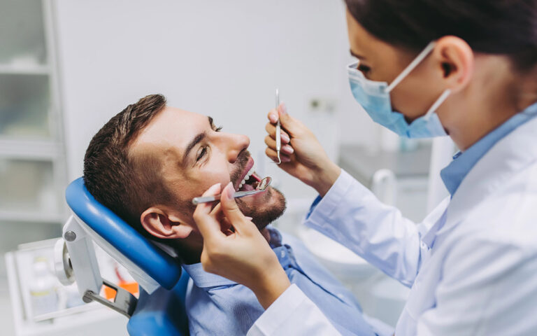 man at the dentist for a checkup