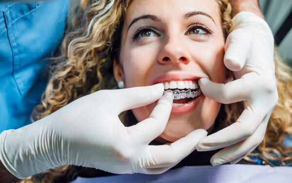 woman with invisalign at the dentist