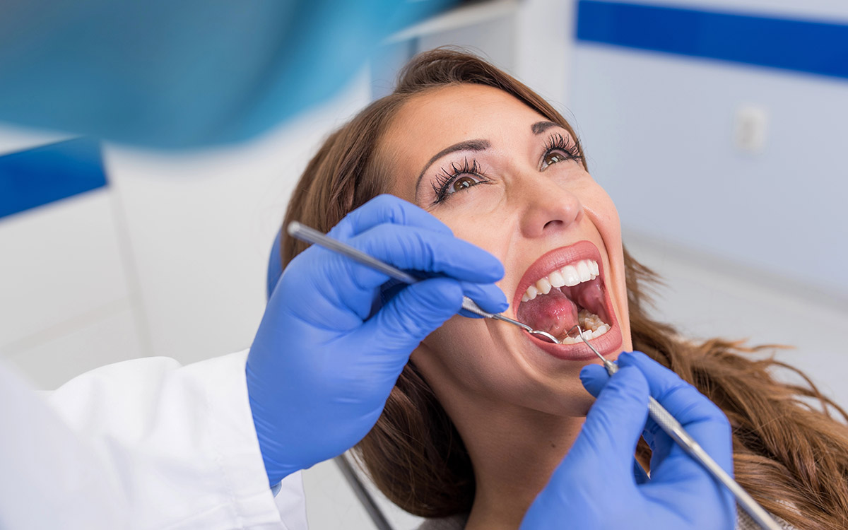 woman with perfect smile at the dentist