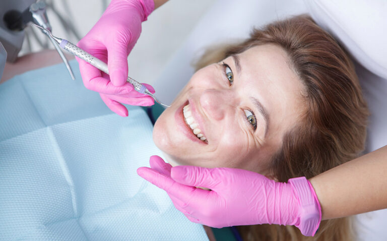 woman smiling during her dental checkup