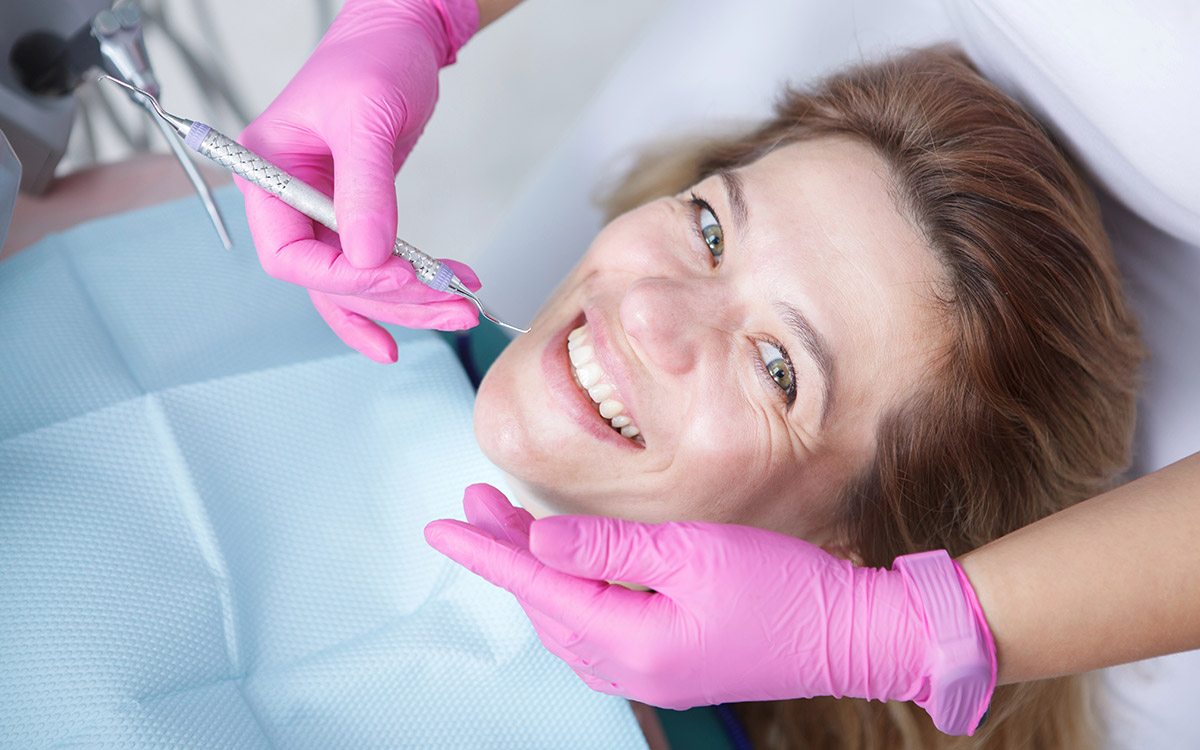 woman smiling during her dental checkup
